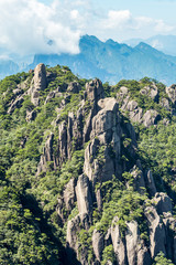 OLYpeaks covered with green with unique formation under blue cloudy sky