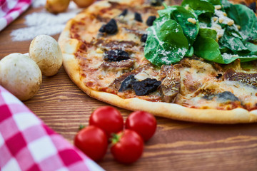 Italian Pizza with Flour and Colorful Vegetables