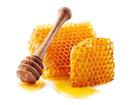 Naklejki Honeycomb with honey on white background