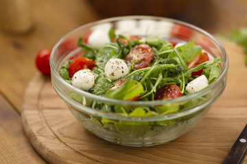 Arugula with mozzarella, tomatoes and olive oil, Caprese salad.