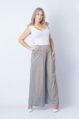 Full length portrait of cheerful blonde woman