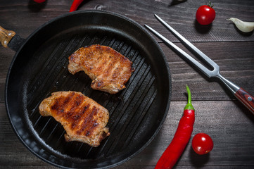 Grilled pork steak on pan