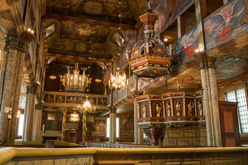 Interior of a wooden church with an organ