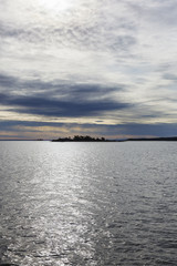 Sunset view of the water with isles in silhouette