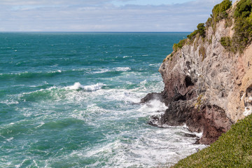 Fototapeta na wymiar Waves crashing on cliff (4)