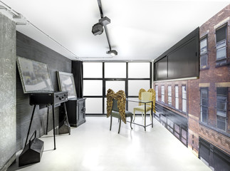 Vintage consulting room with wallpaper, trendy chairs and big windows. Fashion, manicure and beauty interior business,