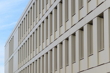 Wide rectangular concrete building with windows