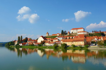 Fototapeta na wymiar Ptuj, Slovenia, is the oldest city in Slovenia with a castle overlooking the old town from a hill and the Drava river beneath
