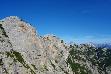Fototapeta na wymiar Hiking trail leading from Lago del Predil to Bivacco Gorizia and Cima delle Forcelle in Dolomites, Alps, Italy