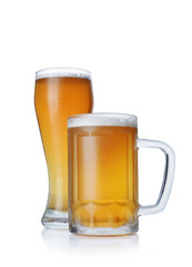 Glass and mug of cold light beer with foam