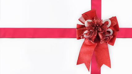 Red ribbon with bell on white background, holiday and event concept and decoration idea