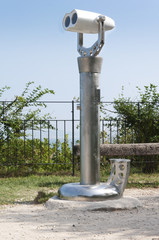 stationary binoculars with a coin box on the observation deck for sightseeing