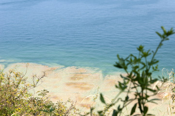 beautiful stone lake shore on a clear summer day