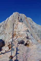 Climbing and Hiking trail leading to the top of the highest mountain of Slovenia - Triglav in...