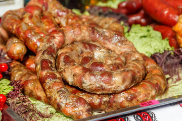 Assortment of grilled sausages for sale. Street food, fast food