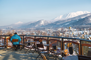 Outdoor mountain cafe in winter season, Poland, ski resort Zakopane, mountains of Polish Tatras