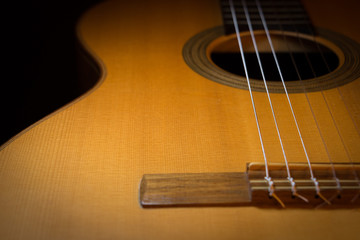 Obraz premium acoustic guitar on black background