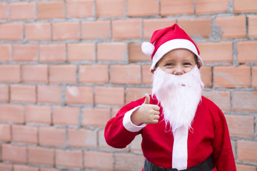 boy disguised as Santa Claus on the street. Christmas card