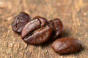 Close-up of coffee beans on a wooden table