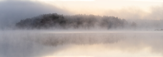 Misty morning over lake