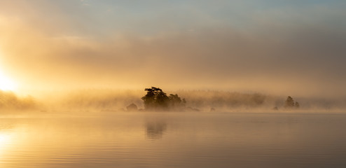 Misty morning over lake