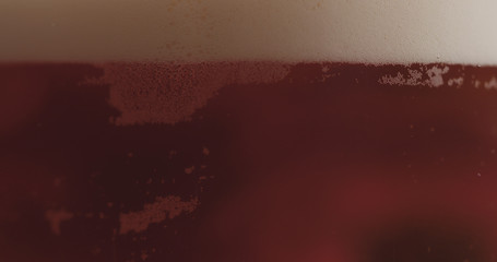 closeup pouring ale beer in a glass