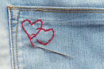 red hearts on jeans trousers