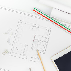 Interior designer table workplace with house plan