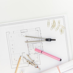 Interior designer table workplace with house plan