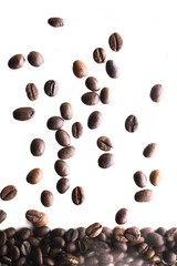 Roasted coffee beans falling down
