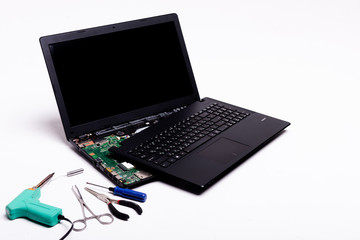 disassembled laptop on a white background, laptop repair, details of a laptop