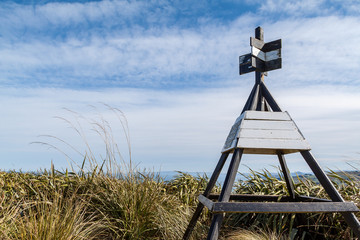 Beacon on top of hill with cloudy sky