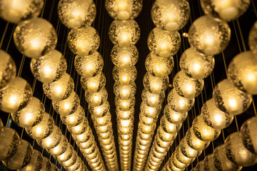 Close up many yellow lamp in cafe at night