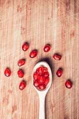 Red pomegranate fruit seed. Shallow depth of field. Retro vintage effect