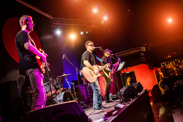 Band performs on stage in a nightclub