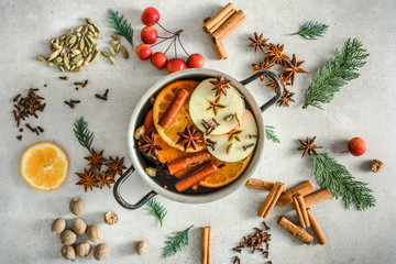 Christmas cooking. Mulled wine with spices or tea, hot drink preparation.
