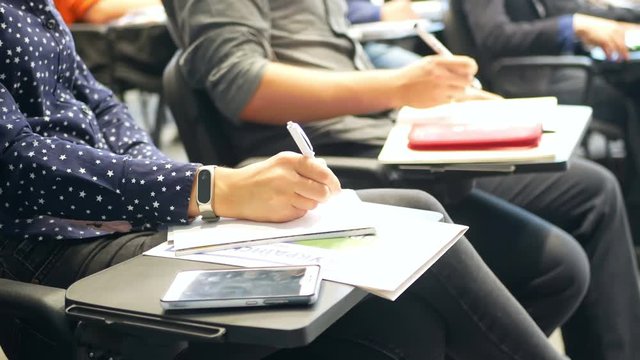 Students writing notebooks