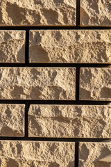 Wall from decorative yellow brick as a background