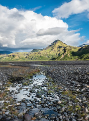 Glacial river in the dramatically beautiful and surreal landscapes of Thorsmork valley in the Highlands of Iceland at southern end of the famous Laugavegur hiking trail.