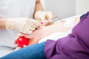 Doctors assistant setting vein access in patient
