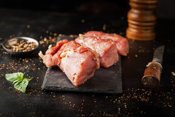 Fresh raw tenderloin in marinade with spices