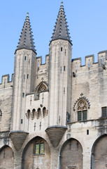 Exterior design architecture of Papal palace (Palais des papes) under clear blue sky in Avignon, France