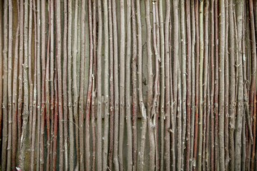 Fence of wooden branches as a background