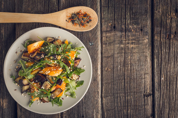 Salad baked eggplant and fresh tomatoes and arugula