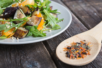 Salad baked eggplant and fresh tomatoes and arugula