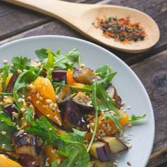 Salad baked eggplant and fresh tomatoes and arugula
