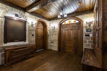 Basement foyer area with wood cabinetry