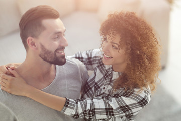 Beautiful young couple on a blurred background.