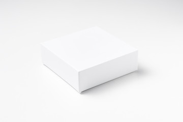 Close up of white cardboard gift box on white background isolated