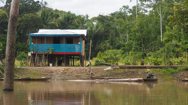 remote village houses at the amazonas river in peru